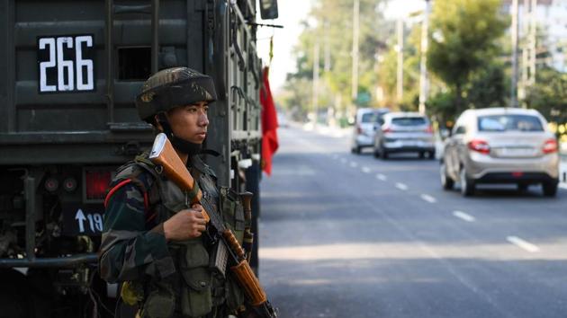 A soldier guards a street following violent protests against the Citizenship Amendment Bill, Guwahati, December 13, 2019(AFP)