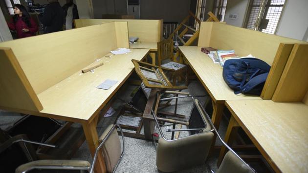 A view of the damaged JMI library after police entered the campus on Sunday evening. The alleged police brutality on Sunday evening left many students at JMI and AMU injured or hospitalised. The campuses resembled a war zone with police fighting pitched battles with protesters and firing tear gas shells. A midnight gathering at the Delhi Police headquarters only dispersed around 5am on Monday after all students were released from police custody. (Burhaan Kinu / HT Photo) 