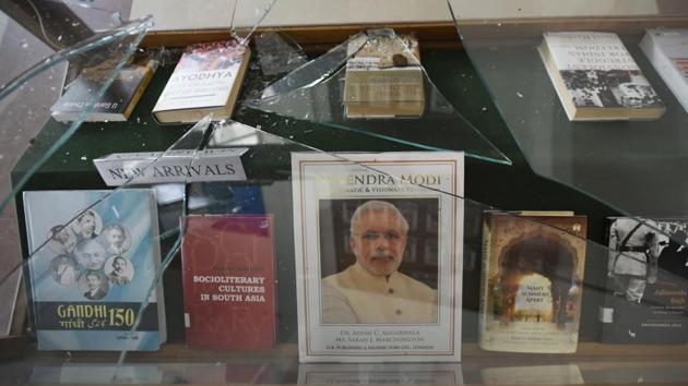 A view of the shattered glass at the damaged Zakir Husain library after police entered the campus later on Sunday evening and beat students, at JMI. As student anger simmered, Prime Minister Narendra Modi appealed for calm and said no Indian citizen would be affected by the CAA.”This is the time to maintain peace, unity and brotherhood. It is my appeal to everyone to stay away from any sort of rumour mongering and falsehoods,” he added. (Burhaan Kinu / HT Photo) 