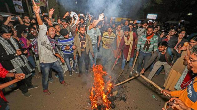 Students of Visva-Bharati University burn an effigy during a protest against the Sunday’s police crackdown in JMI, at Santiniketan in Birbhum district of West Bengal. Students boycotted classes at Central University of Kerala, Kasargod, Maulana Azad Urdu University, Hyderabad, Pondicherry University and BHU leading to cancellation of all examinations on Monday. (PTI) 