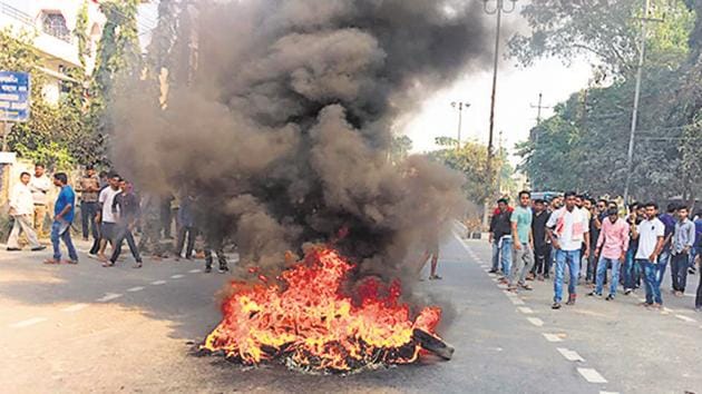 Tyres burn as protests rage in Guwahati, Assam against the Citizenship Amendment Bill (CAB) during the 11-hr northeast shutdown called on December 10 by North East Students Organisation (NESO). (HT Photo)
