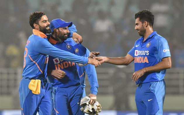 Indian captain Virat Kohli celebrates with pacers Md Shami and Deepak Chahar. (PTI)