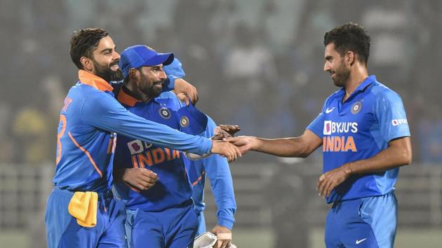 Indian captain Virat Kohli celebrates with pacers Md Shami and Deepak Chahar after their win in the 2nd ODI against West Indies at ACA-VDCA Cricket Stadium in Visakhapatnam.(PTI)