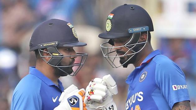 India's Rohit Sharma, left, interacts with batting partner KL Rahul.(AP)