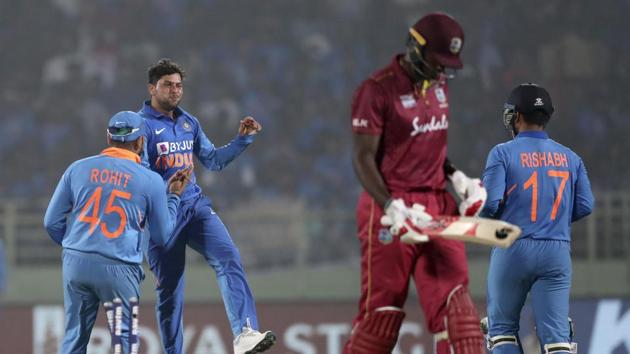 India's Kuldeep Yadav celebrates the dismissal of West Indies' Jason Holder during the second one day international cricket match between India and West Indies in Visakhapatnam, India.(AP)