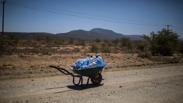 A wheelbarrow containing refilled bottles of water stands on a road towards the Bezuidenhoutville informal settlement in Adelaide. The Eastern Cape Province of South Africa is far from being the only South African province affected by this very long drought. The crisis is almost national, with dramatic consequences, for farmers of course, but also for schoolchildren and businesses. (Guillem Sartorio / AFP) A wheelbarrow containing refilled bottles of water stands on a road towards the Bezuidenhoutville informal settlement in Adelaide. The Eastern Cape Province of South Africa is far from being the only South African province affected by this very long drought. The crisis is almost national, with dramatic consequences, for farmers of course, but also for schoolchildren and businesses. (Guillem Sartorio / AFP)
