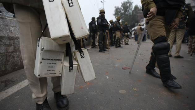 A police personnel holds tear gas boxes during the protest. “The protesters started breaking barricades, pelting stones, bottles and clashed with our staff. Many police personnel and civilians were injured. To contain the situation, we resorted to lathi-charge, and launched tear gas shells and gas grenades. The agitated mob was sent back to their respective areas and the situation was brought under control by around 5pm,” said additional deputy commissioner of police (northeast) RP Meena. (Burhaan Kinu / HT Photo) A police personnel holds tear gas boxes during the protest. “The protesters started breaking barricades, pelting stones, bottles and clashed with our staff. Many police personnel and civilians were injured. To contain the situation, we resorted to lathi-charge, and launched tear gas shells and gas grenades. The agitated mob was sent back to their respective areas and the situation was brought under control by around 5pm,” said additional deputy commissioner of police (northeast) RP Meena. (Burhaan Kinu / HT Photo)
