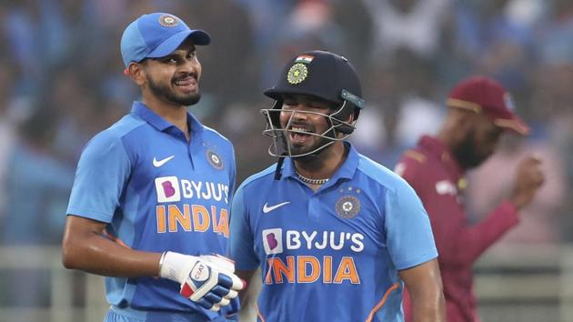 India's Shreyas Iyer, left, and Rishabh Pant celebrate scoring runs.(AP)