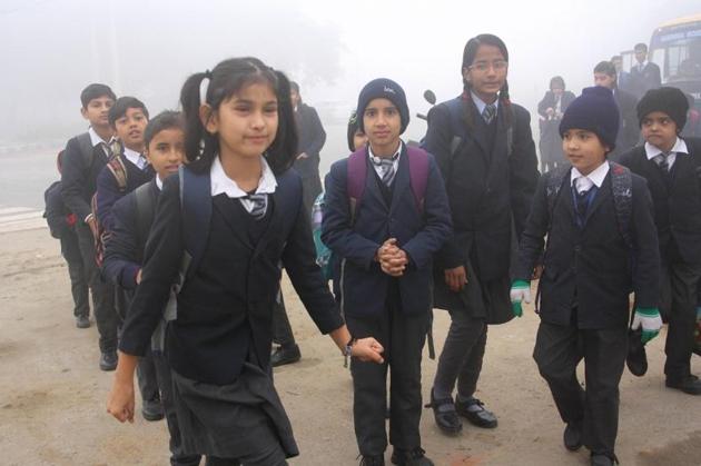 Children heading for school amid fog in Rohtak on Thursday morning. The town in Haryana recorded a low of 5.6 degrees Celsius. (Manoj Dhaka/HT) Children heading for school amid fog in Rohtak on Thursday morning. The town in Haryana recorded a low of 5.6 degrees Celsius. (Manoj Dhaka/HT)