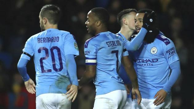 Holders Manchester City will face Manchester United in the semi-finals of the League Cup after both sides saw off lower league opposition to make the last four on Wednesday.(AP)