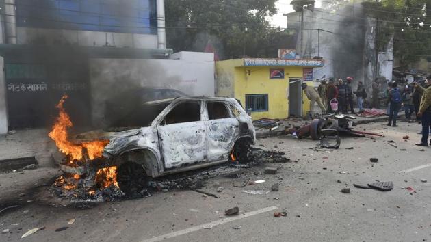 A vehicle torched allegedly by protesters during a demonstration against CAA at Madeyganj in Lucknow, Uttar Pradesh. Police fired tear-gas shells in the area as protesters smashed vehicles parked outside a police post. About 20 people were taken into custody. Internet services remained suspended for at least part of the day at various places, including Aligarh, Sambhal, Mau and Azamgarh districts. CM Yogi Adityanath said the government will make those who damaged property pay for it. (Nand Kumar / PTI) 