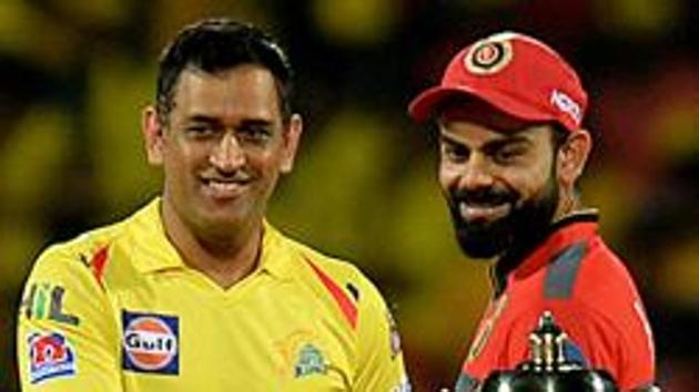 File photo of CSK captain MS Dhoni and RCB captain Virat Kohli with the IPL trophy. (AFP) File photo of CSK captain MS Dhoni and RCB captain Virat Kohli with the IPL trophy. (AFP)