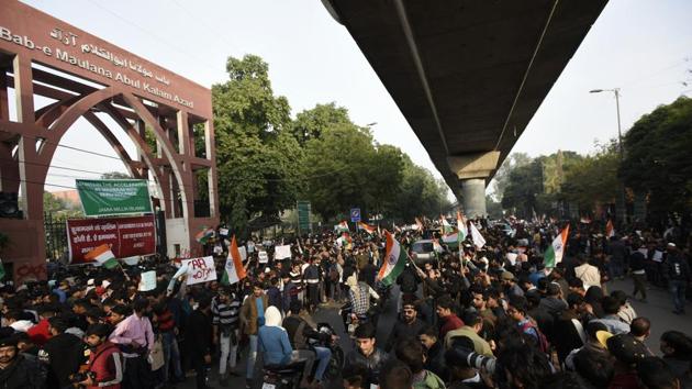 Students and local residents hold placards and raise slogans as they take part in a protest against the Citizenship Amendment Act (CAA) and National Register of Citizens (NRC), at Jamia Millia Islamia University, in New Delhi. (Burhaan Kinu/HT PHOTO) Students and local residents hold placards and raise slogans as they take part in a protest against the Citizenship Amendment Act (CAA) and National Register of Citizens (NRC), at Jamia Millia Islamia University, in New Delhi. (Burhaan Kinu/HT PHOTO)
