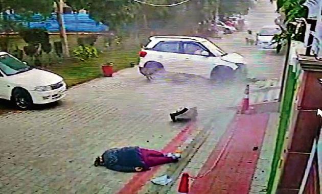 A CCTV grab showing the victim and the car that hit her at Rajguru Nagar in Ludhiana.(HT PHOTO)