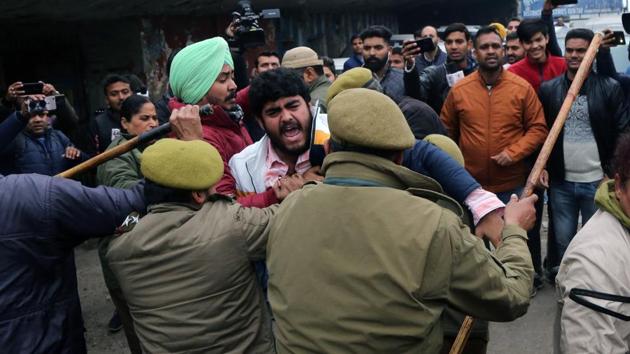Members of Jammu and Kashmir Youth congress party clash with police during a protest against Delhi police action on students of JMI and CAA, in Jammu. Internet and text messaging services were suspended by government order in parts of New Delhi, widening a communications clampdown in restive areas stretching from disputed Kashmir to the northeast. The outage affecting services provided by Vodafone Idea and Bharti Airtel resumed around 1 pm after a four-hour outage. (Alok Pathania / ANI) 