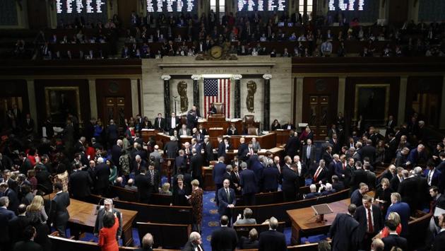 House members vote as Speaker Nancy Pelosi stands on the dias during a vote on Article II of Impeachment against Trump in the House Chamber of the US Capitol, Washington. By a 230 to 197 vote in the Democratic-majority House, the 45th US president became just the third occupant of the White House in American history to be impeached. (Patrick Semansky / AP)