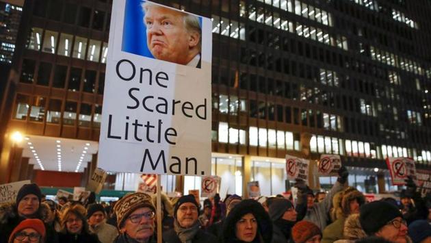 Protesters take part in a rally to support the impeachment and removal of Trump in Chicago, Illinois. The House vote came four months after a whistleblower blew open the scandal of Trump pressuring Ukraine’s president to investigate his potential White House challenger in 2020, the veteran Democrat Joe Biden. Democrats declared after Wednesday’s vote that McConnell needs testimony from four current and former White House aides with direct knowledge of Trump’s Ukraine dealings. (Kamil Krzaczynski / REUTERS)