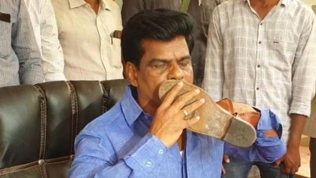 YSR Congress Party leader Goranthla Madhav kissing a policeman’s boot at a press conference in Hyderabad on Friday. (HT Photo) YSR Congress Party leader Goranthla Madhav kissing a policeman’s boot at a press conference in Hyderabad on Friday. (HT Photo)
