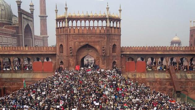 Protestors hold a demonstration against the Citizenship Amendment Act (CAA) at Jama Masjid after the Friday prayers. (PTI)