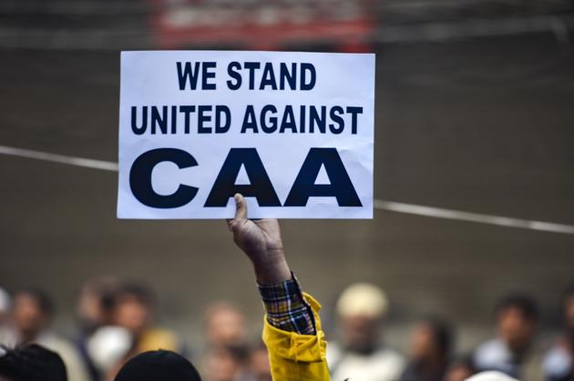 New A protestor holds a placard during a demonstration against the Citizenship Amendment Act (CAA), New Delhi, December 20, 2019 (PTI) New A protestor holds a placard during a demonstration against the Citizenship Amendment Act (CAA), New Delhi, December 20, 2019 (PTI)