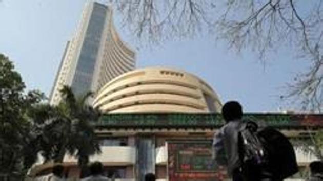 People look at a screen displaying the Sensex results on the facade of the Bombay Stock Exchange (BSE) building in Mumbai. (REUTERS / Representational Photo) People look at a screen displaying the Sensex results on the facade of the Bombay Stock Exchange (BSE) building in Mumbai. (REUTERS / Representational Photo)
