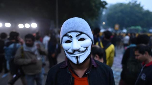 A demonstrator in an anonymous facemask against the Citizenship Amendment Act (CAA) and National Register of Citizens (NRC) at Jantar Mantar in New Delhi. (Sanchit Khanna/HT PHOTO)