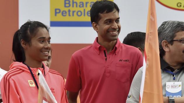 Indian badminton coach Pullela Gopichand and Athlete Hima Das.(PTI)