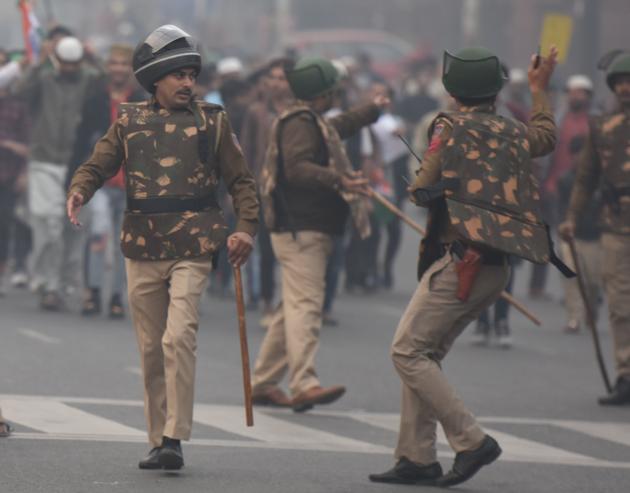 Police personnel seen during a protest against new citizenship law at Daryaganj in New Delhi on December 20, 2019. (Photo by Raj K Raj/ Hindustan Times)