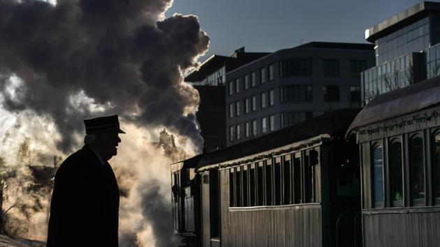 Steam billows from a locomotive as The Polar Express departs for the “North Pole” under the watch of conductor Jerry Angier in Portland, Maine. The annual holiday journey is staffed mostly by volunteers and is the largest annual fundraiser for the Maine Narrow Gauge Railroad Museum. (Robert F. Bukaty / AP) Steam billows from a locomotive as The Polar Express departs for the “North Pole” under the watch of conductor Jerry Angier in Portland, Maine. The annual holiday journey is staffed mostly by volunteers and is the largest annual fundraiser for the Maine Narrow Gauge Railroad Museum. (Robert F. Bukaty / AP)