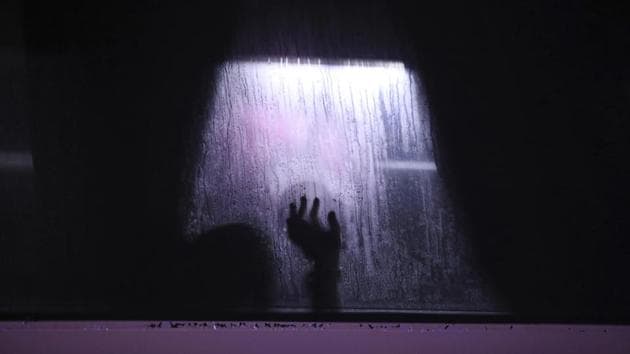 A migrant puts his hand on the window of a bus in Alvarado, Veracruz state, Mexico. The migrant was one of dozens of people rescued by police after being kidnapped while traveling north. (Felix Marquez / AP) A migrant puts his hand on the window of a bus in Alvarado, Veracruz state, Mexico. The migrant was one of dozens of people rescued by police after being kidnapped while traveling north. (Felix Marquez / AP)