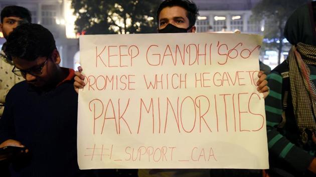 New Delhi, India - Dec. 20, 2019: A man holds a placard during a march in support of Citizenship Amendment Act (CAA), at Rajiv Chowk, Inner Circle Connaught Place in New Delhi, India, on Friday, December 20, 2019. (Photo by Amal KS / Hindustan Times) (Amal KS/HT PHOTO) New Delhi, India - Dec. 20, 2019: A man holds a placard during a march in support of Citizenship Amendment Act (CAA), at Rajiv Chowk, Inner Circle Connaught Place in New Delhi, India, on Friday, December 20, 2019. (Photo by Amal KS / Hindustan Times) (Amal KS/HT PHOTO)