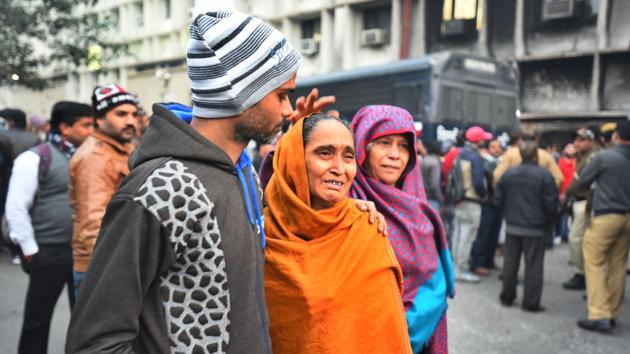 Family members of a detained protester break down after Delhi Police produced the protesters at Tis Hazari Court in New Delhi. 15 people arrested in connection with the violence in Old Delhi’s Daryaganj area were produced at the court on Saturday. The police has sought 14 days’ judicial custody of those detained. One of those arrested claimed he was a juvenile. However, police said he is aged 23. (Raj K Raj / HT Photo)