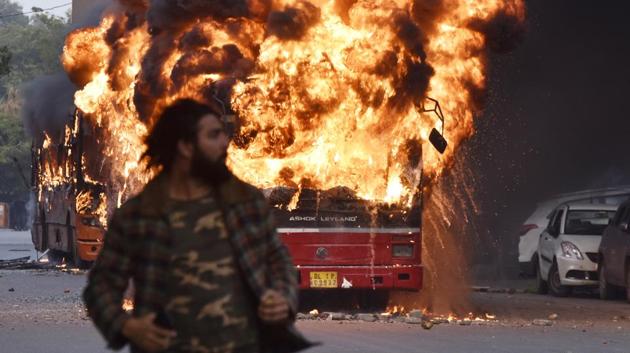 A burning bus is seen after it was set on fire by miscreants during a protest against Citizenship Amendment Act, at New Friends Colony, in New Delhi. (Sanjeev Verma / HT Photo) A burning bus is seen after it was set on fire by miscreants during a protest against Citizenship Amendment Act, at New Friends Colony, in New Delhi. (Sanjeev Verma / HT Photo)