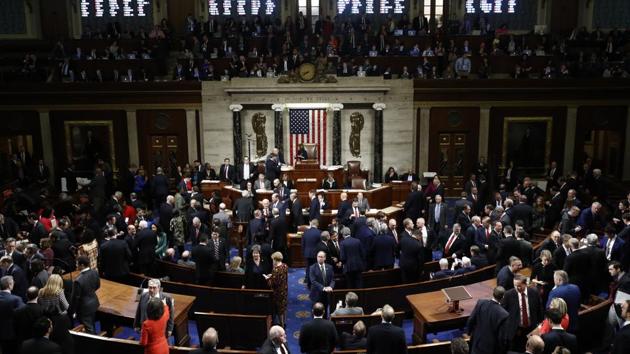 House members vote as House Speaker Nancy Pelosi stands on the dias during a vote on Article II of Impeachment against President Donald Trump, at Capitol Hill in Washington, US. (Patrick Semansky / AP) House members vote as House Speaker Nancy Pelosi stands on the dias during a vote on Article II of Impeachment against President Donald Trump, at Capitol Hill in Washington, US. (Patrick Semansky / AP)