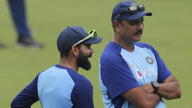 Indian cricket captain Virat Kohli, left, speaks with coach Ravi Shastri during a training session.(AP)