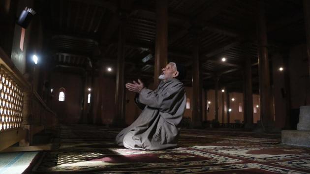An elderly Kashmiri Muslim man prays inside Jamia Masjid in Srinagar, Jammu and Kashmir. A call to afternoon prayer rung out from the central mosque Srinagar for the first time in more than four months, ending a virtual ban on religious practice in the region’s biggest mosque. The Jamia Masjid was shut August 5. (Mukhtar Khan / AP) An elderly Kashmiri Muslim man prays inside Jamia Masjid in Srinagar, Jammu and Kashmir. A call to afternoon prayer rung out from the central mosque Srinagar for the first time in more than four months, ending a virtual ban on religious practice in the region’s biggest mosque. The Jamia Masjid was shut August 5. (Mukhtar Khan / AP)