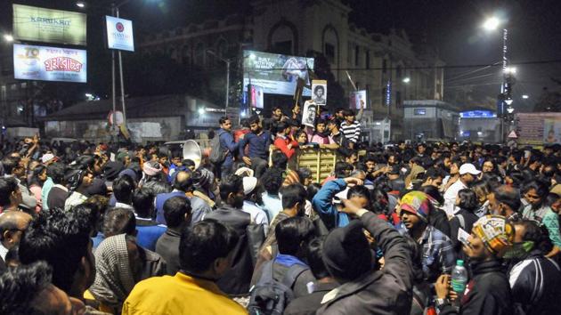 University students participate in a road blockade during their protest rally against CAA(Citizen Amendment Act) and NRC in Kolkata. (PTI Photo) University students participate in a road blockade during their protest rally against CAA(Citizen Amendment Act) and NRC in Kolkata. (PTI Photo)