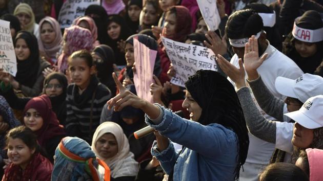 Demonstrators shout slogans and hold placards as they attend a protest against a Citizenship Amendment Act (CAA), at Jamia Millia University, in New Delhi, India, on December 21, 2019. (Sanjeev Verma/HT PHOTO) Demonstrators shout slogans and hold placards as they attend a protest against a Citizenship Amendment Act (CAA), at Jamia Millia University, in New Delhi, India, on December 21, 2019. (Sanjeev Verma/HT PHOTO)