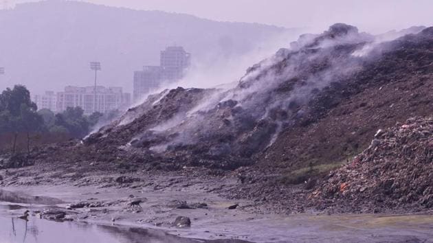 Smoke ceases to subside at the Diva dumping ground, where frequent fires of both small and large magnitudes impact the dumping area and cause smog in Thane, Maharashtra. (Praful Gangurde / HT Photo) Smoke ceases to subside at the Diva dumping ground, where frequent fires of both small and large magnitudes impact the dumping area and cause smog in Thane, Maharashtra. (Praful Gangurde / HT Photo)