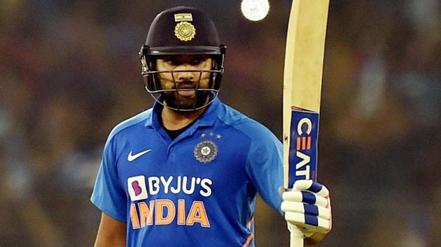 Rohit Sharma raises his bat after completing his half-century. (PTI) Rohit Sharma raises his bat after completing his half-century. (PTI)