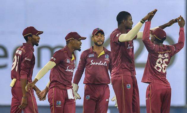 West Indies bowler Jason Holder celebrate with his teammates. (PTI)