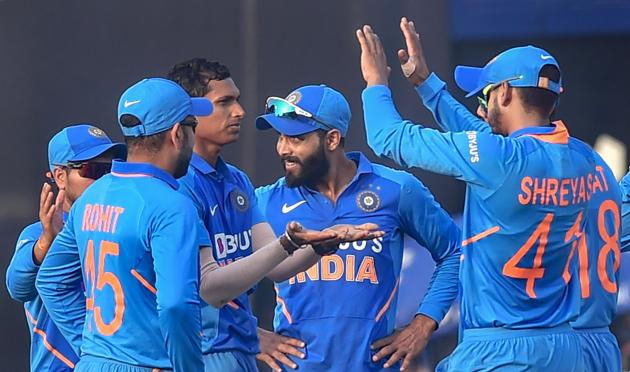 Indian bowler Navdeep Sainia celebrates with teammates after the dismissal of West Indies batsman Roston Chase. (PTI)