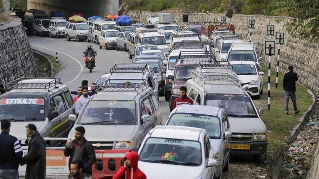 Passenger vehicles stranded on the Srinagar-Jammu national highway after the highway remained shut for the second day on Sunday. (PTI PHOTO.) Passenger vehicles stranded on the Srinagar-Jammu national highway after the highway remained shut for the second day on Sunday. (PTI PHOTO.)