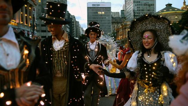 People in costumes take part in an illuminated parade to celebrate the upcoming Christmas. (REUTERS) People in costumes take part in an illuminated parade to celebrate the upcoming Christmas. (REUTERS)