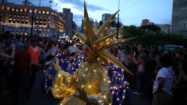 PHOTOS | Merry Christmas 2019: Costumed folk walk the streets of Brazil