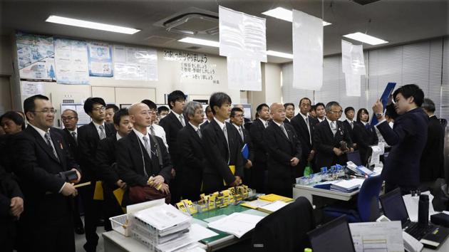 Nihon Kotsu taxi drivers attend a roll call meeting at the company's Akabane office. Visitors always comment on it. And it’s no accident. Take Tokyo taxi driver Norihito Arima, for instance, as he stands alongside 30 or 40 other drivers at a roll call before his 18-hour shift with the taxi company. (Jae C. Hong / AP) 