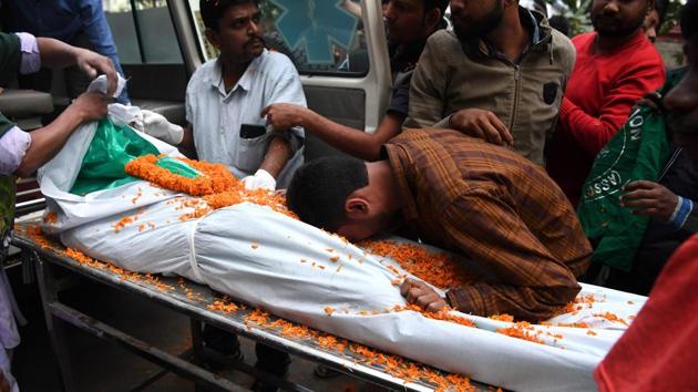 A relative mourns next to the dead body of Ishwor Nayak, 25, who was killed after police fired during a protest against the Citizenship Amendment Act (CAA) in Guwahati, Assam. (Sajjad Hussain / AFP) A relative mourns next to the dead body of Ishwor Nayak, 25, who was killed after police fired during a protest against the Citizenship Amendment Act (CAA) in Guwahati, Assam. (Sajjad Hussain / AFP)