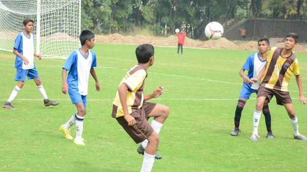 Players of St Vincent's (in yellow) in action against players from JN Petit during the U - 16 Loyola football cup at Loyola School, Pashan on Sunday. (Milind Saurkar/HT Photo) Players of St Vincent's (in yellow) in action against players from JN Petit during the U - 16 Loyola football cup at Loyola School, Pashan on Sunday. (Milind Saurkar/HT Photo)
