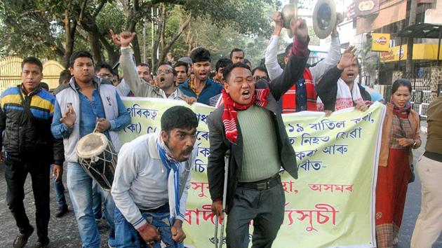 Differently-abled people shout slogans during a procession in protest against the new citizenship law, in Guwahati on Saturday.((ANI Photo))