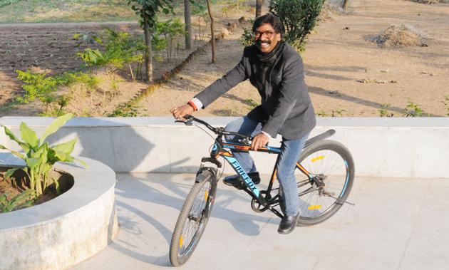 Ranchi, India - Dec. 23, 2019: JMM working president and Chief Ministerial candidate Hemant Soren rides a bicycle when he came to seek blessings after victory in the assembly election at Shibu Soren's residence in Ranchi, Jharkhand, India, on Monday, December 23, 2019. (Photo by Diwakar Prasad/ Hindustan Times) (Diwakar Prasad/ Hindustan Times)